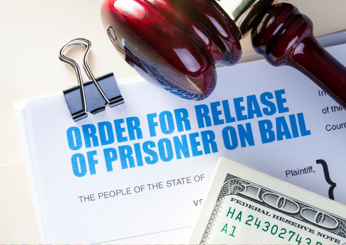 money and gavel over a prisoner release form